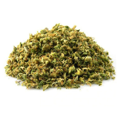Close-up of CBD shake showing small hemp flower pieces and trichomes